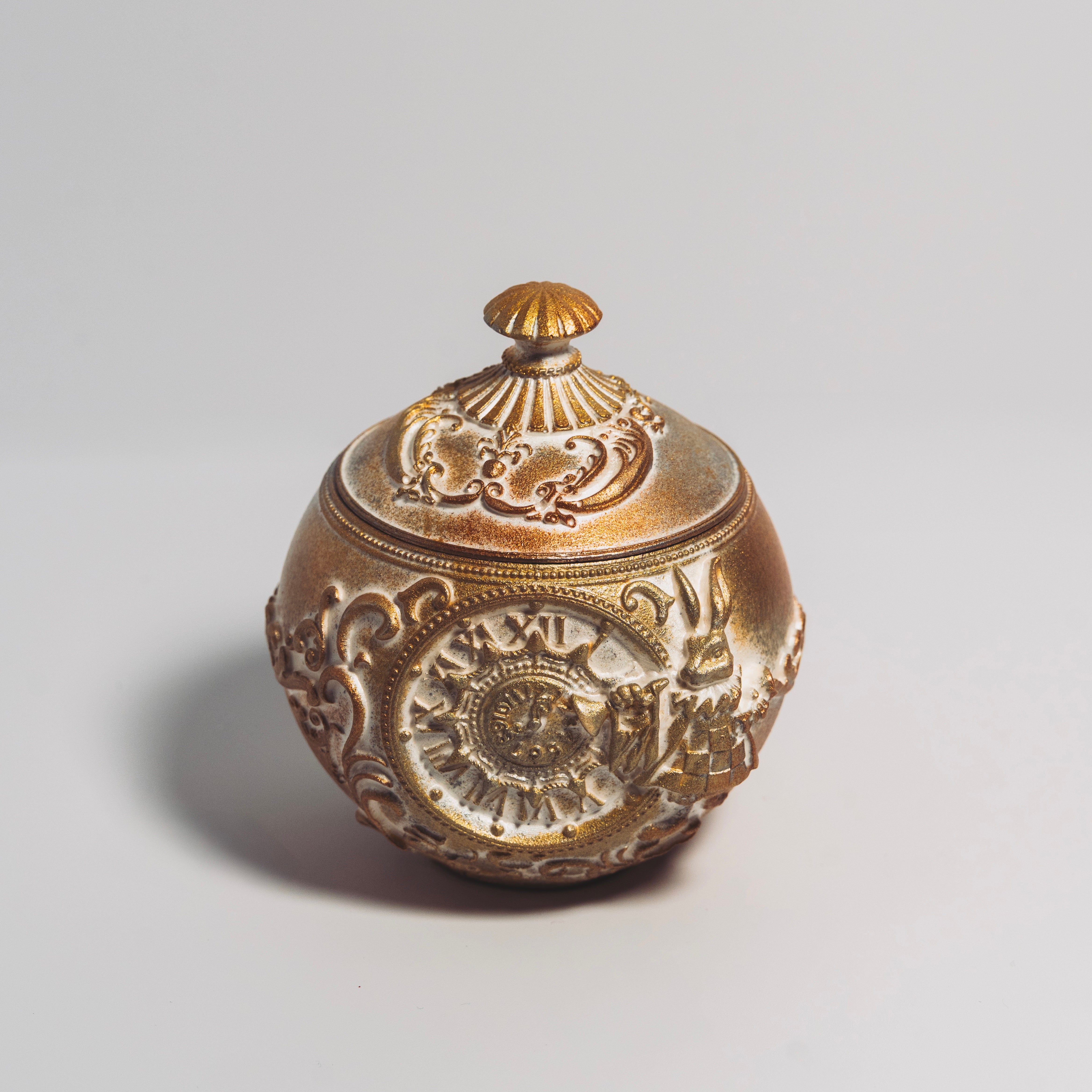 The Holiday Timekeeper Gold Ornament Candle