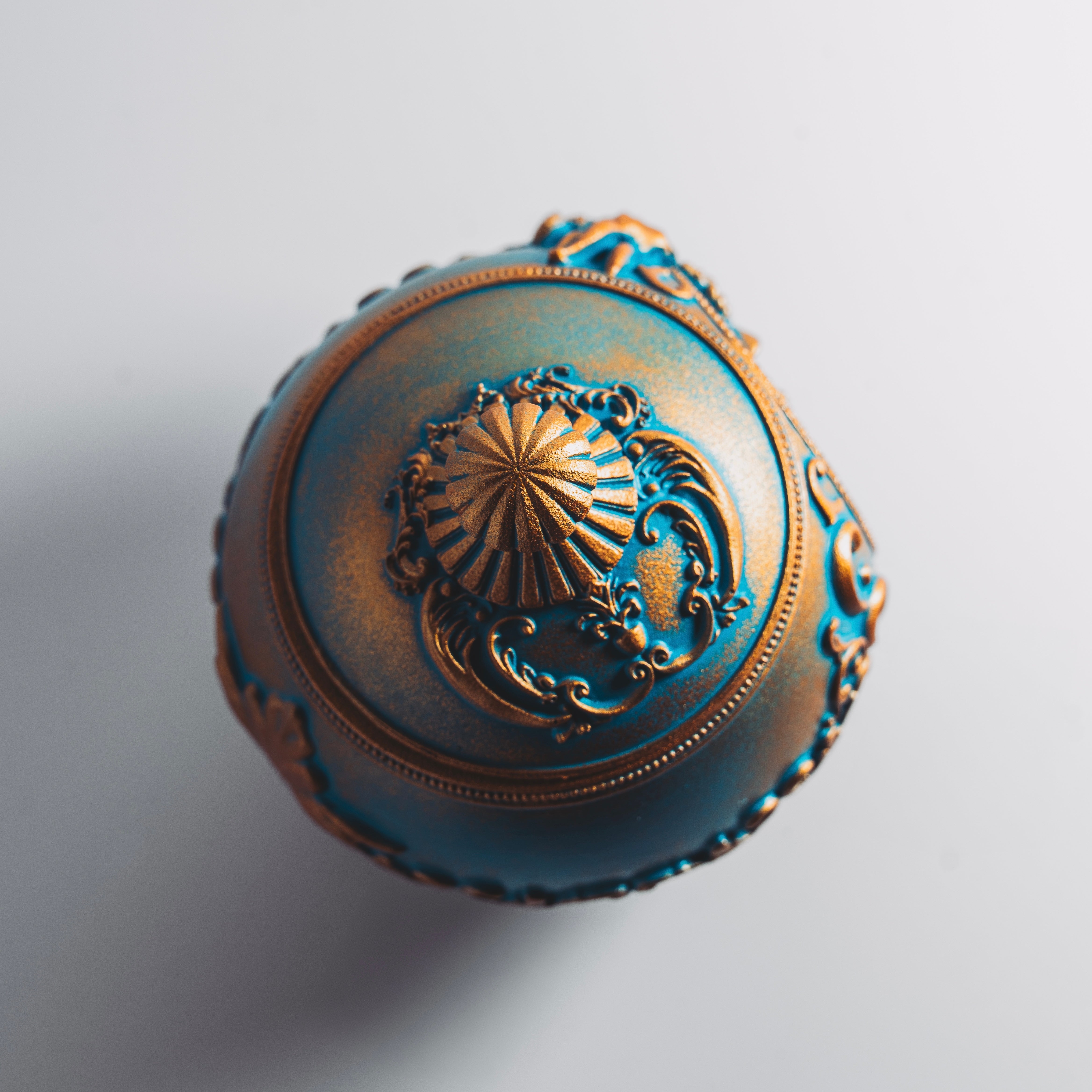 The Holiday Timekeeper Gold Ornament Candle