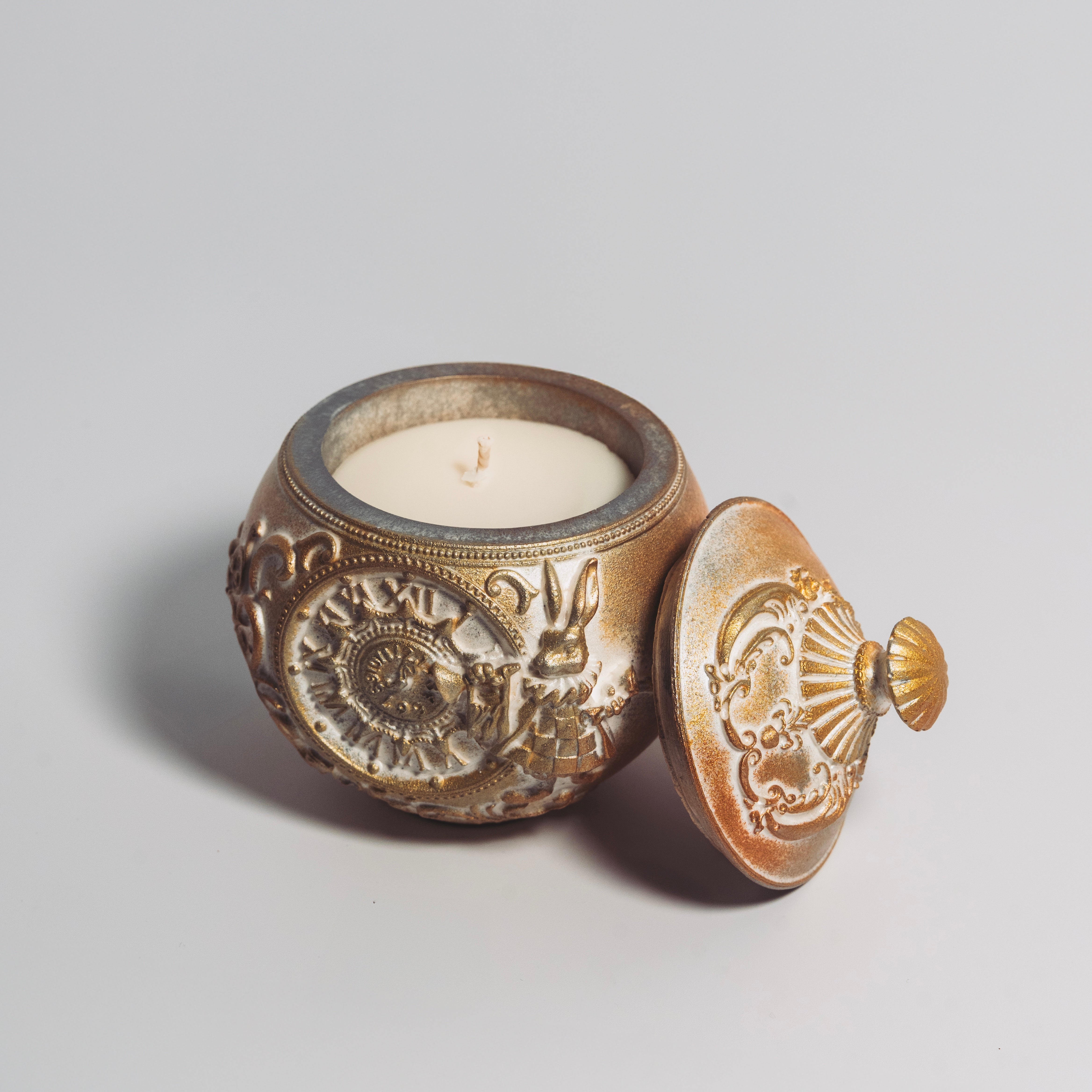The Holiday Timekeeper Gold Ornament Candle