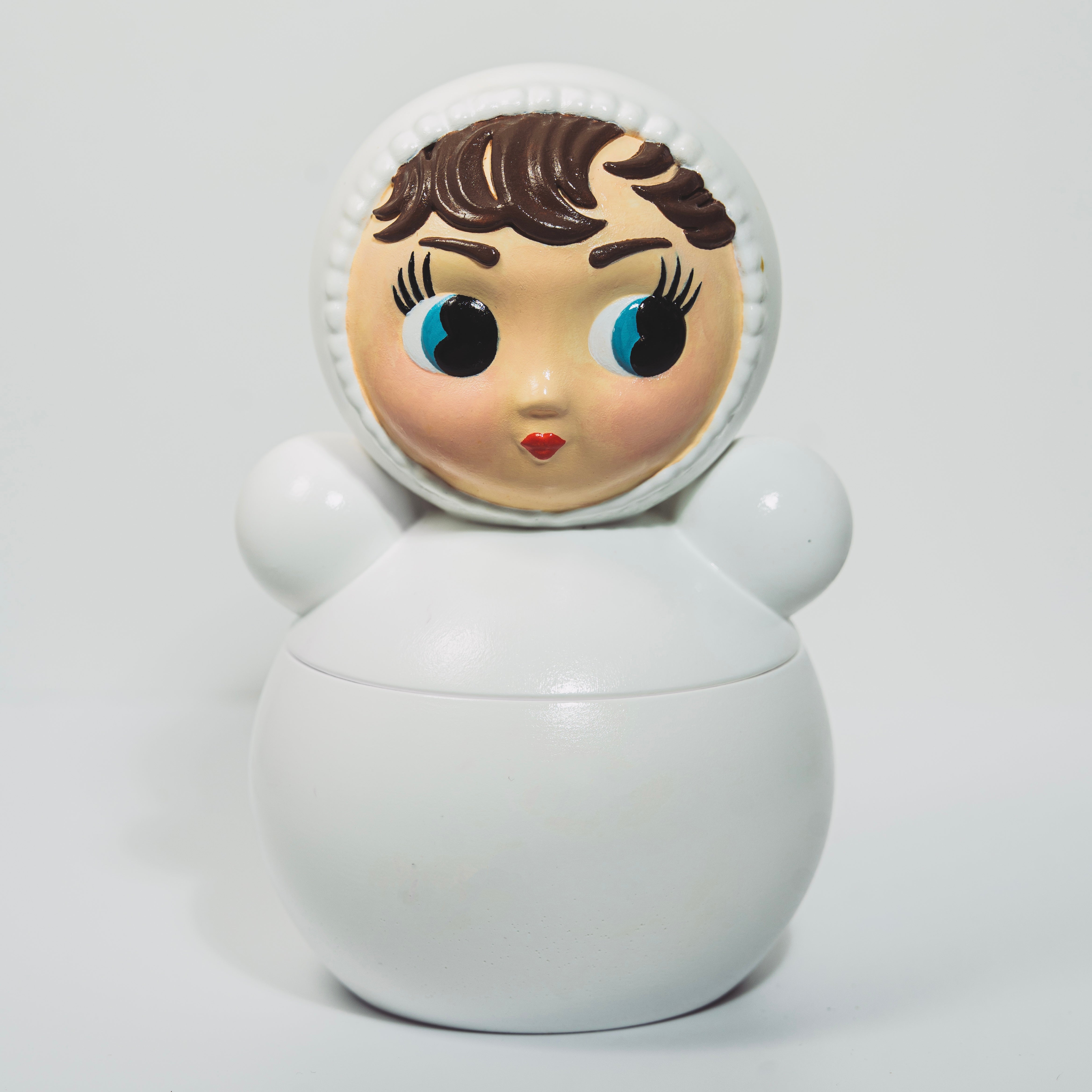 Hand painted roly poly doll candle in white by OVA Collection